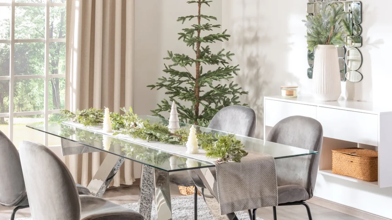 modern white dining room interior with christmas tree decoration and