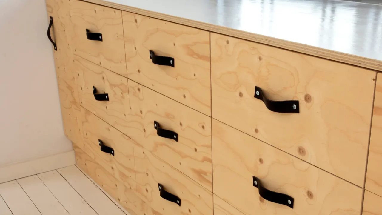 modern wooden storage drawers in retro home with leather handles