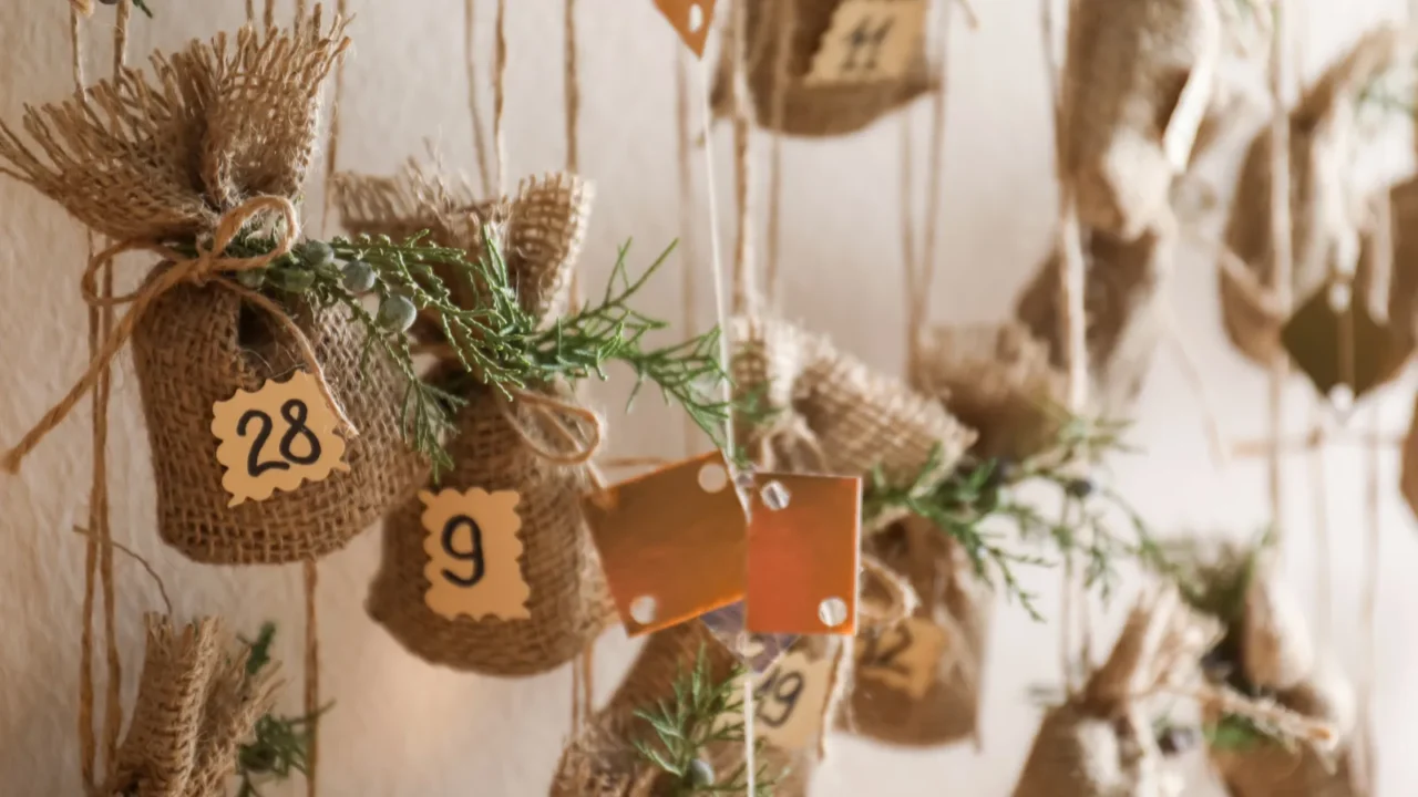 new year advent calendar hanging on beige wall indoors closeup