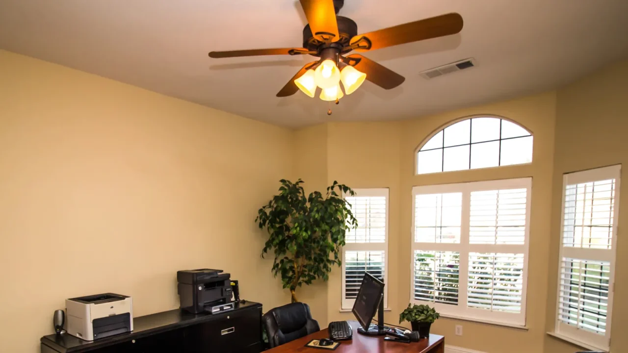 office with wooden desk black file cabinet and computer