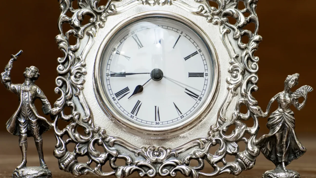 silver clock on the background bokeh