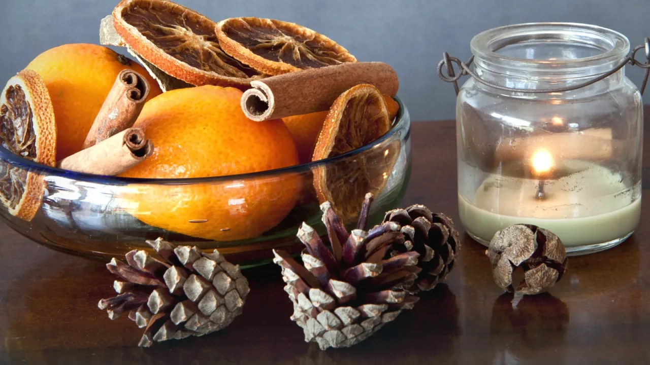 simple christmas bowl with spices and fruits and a candle