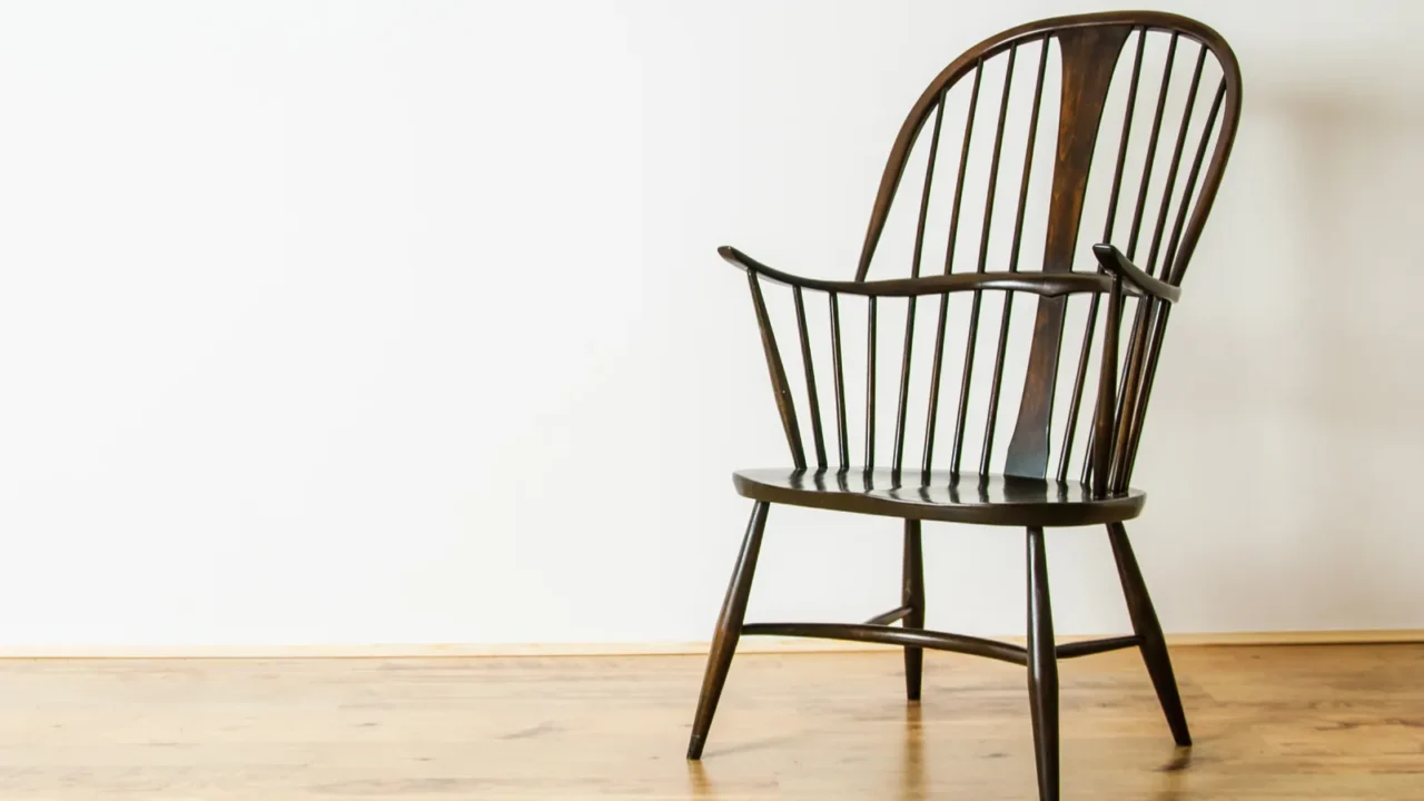 Single windsor style chair in empty room uk