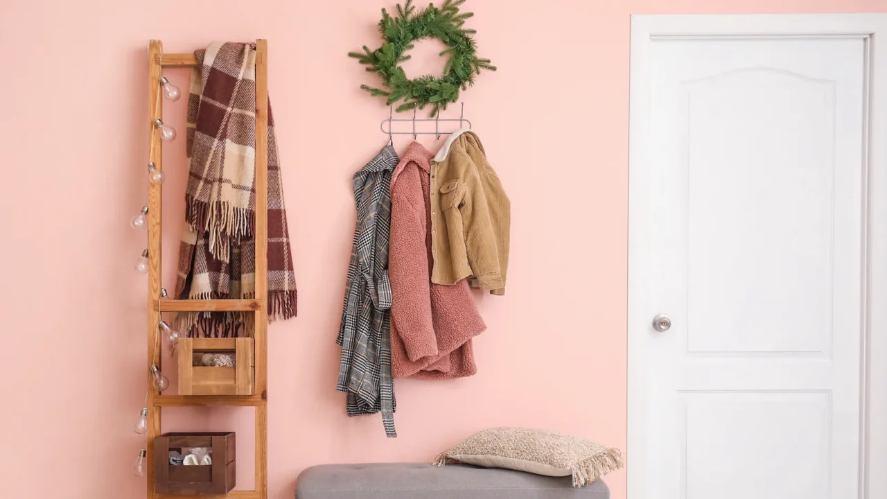 stylish interior of modern hall with winter clothes