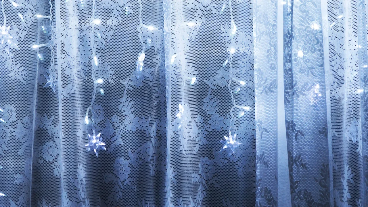 stylized curtains with lights and garland