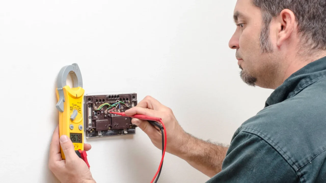 technician working on a thermostat