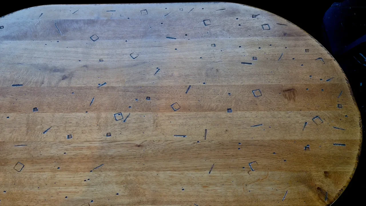 the conference table is battered with tools and bolt decals