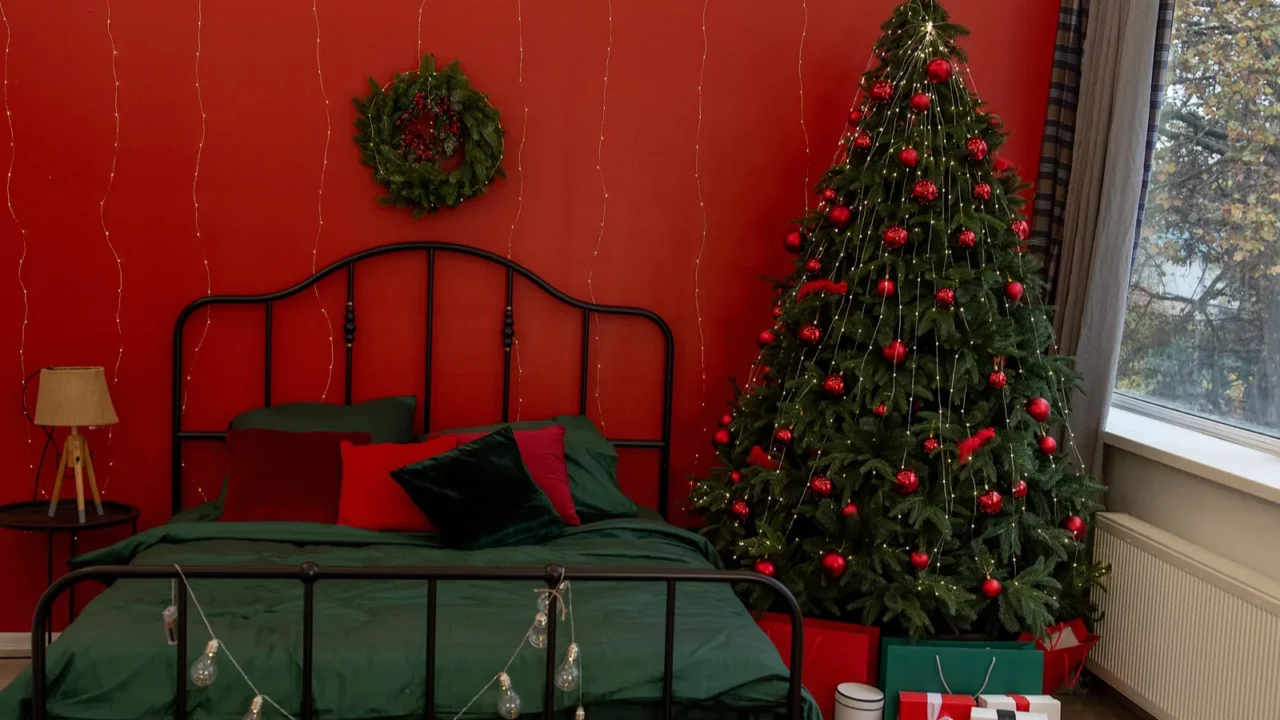 warm inviting bedroom interior with festive christmas decorations lit tree