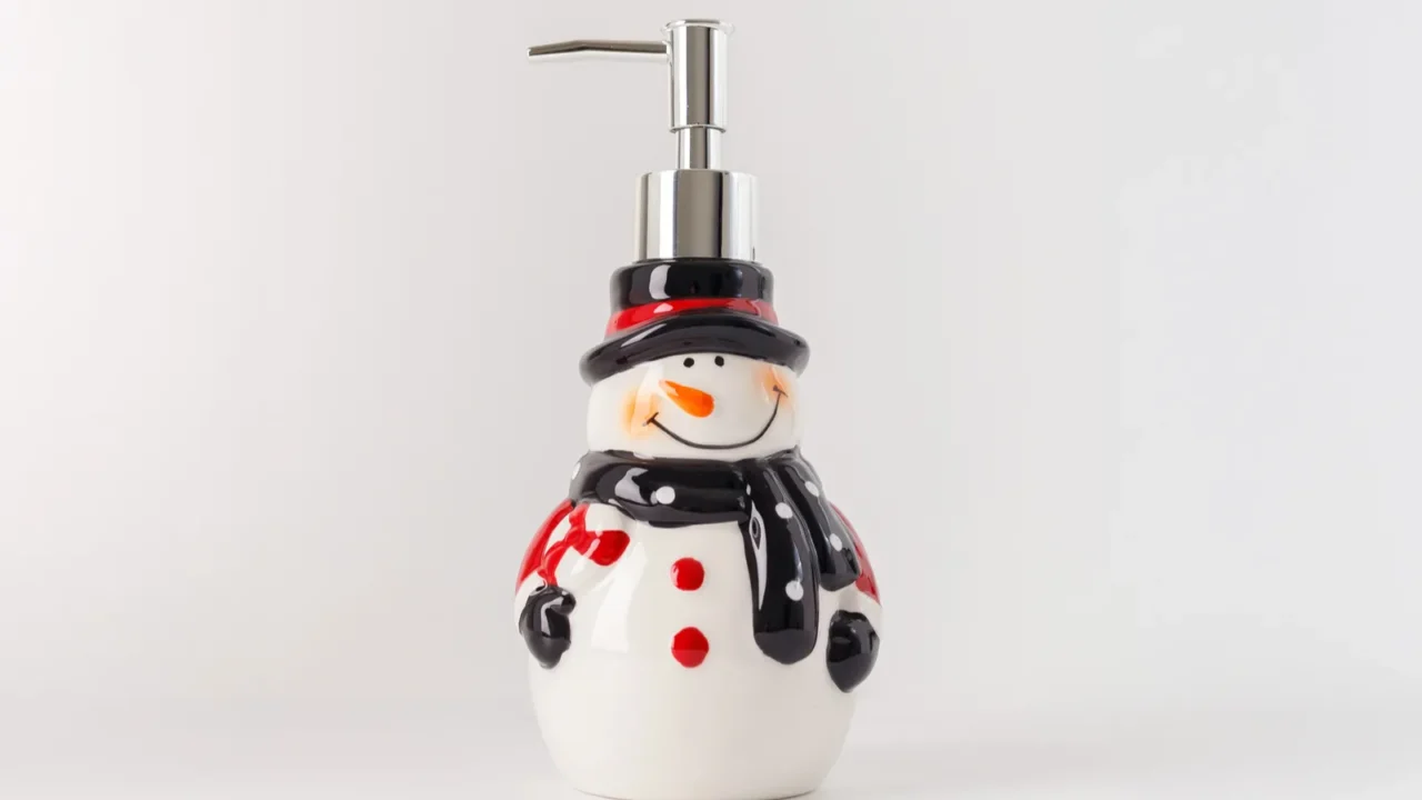 whimsical snowman soap dispenser red buttons silver pump carrot nose