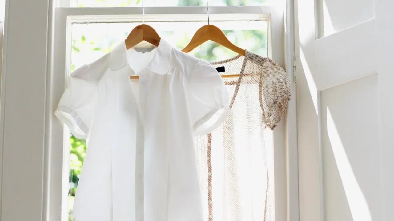 white blouses on hangers