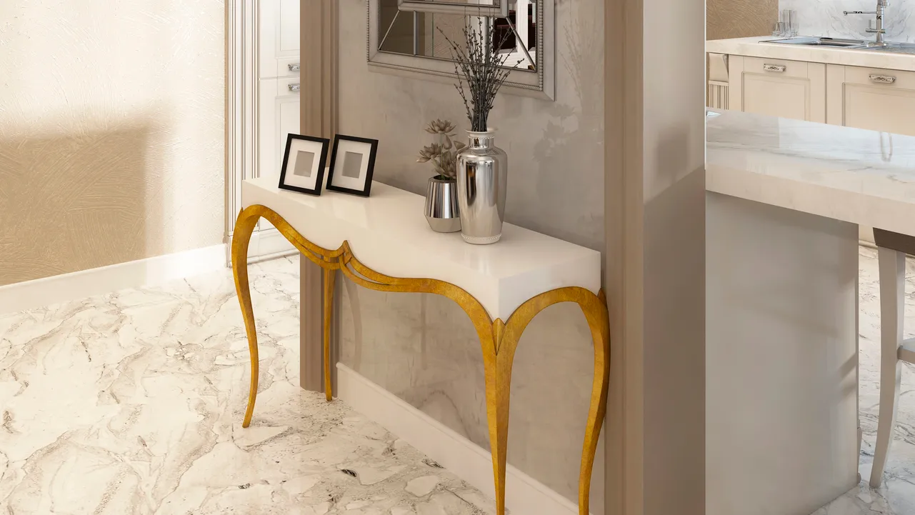 White console table with gold legs from interior walls.