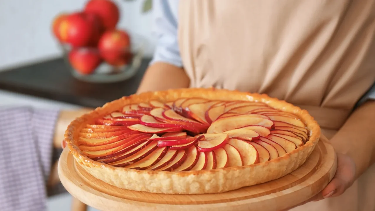 woman holding apple pie