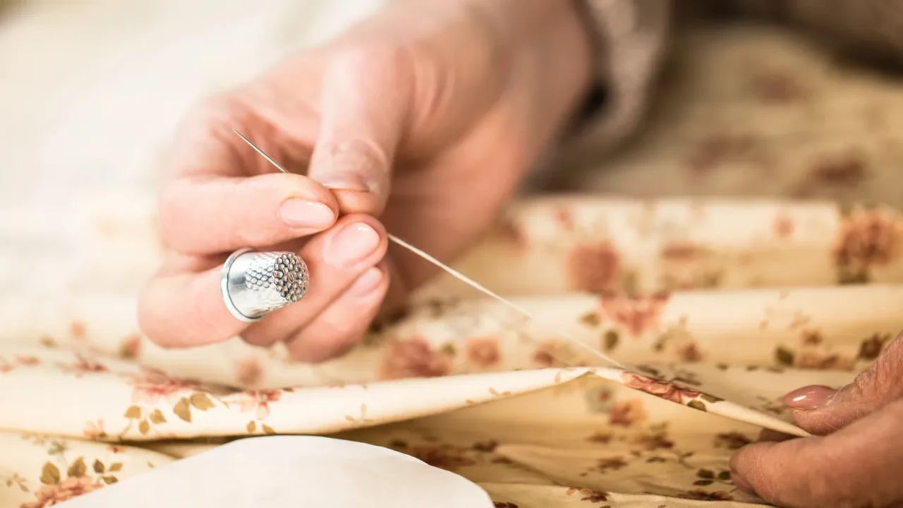 woman sewing cloth