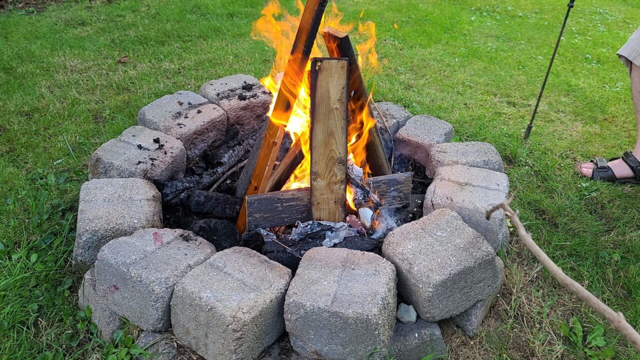 A DIY fire pit made using cinder blocks.