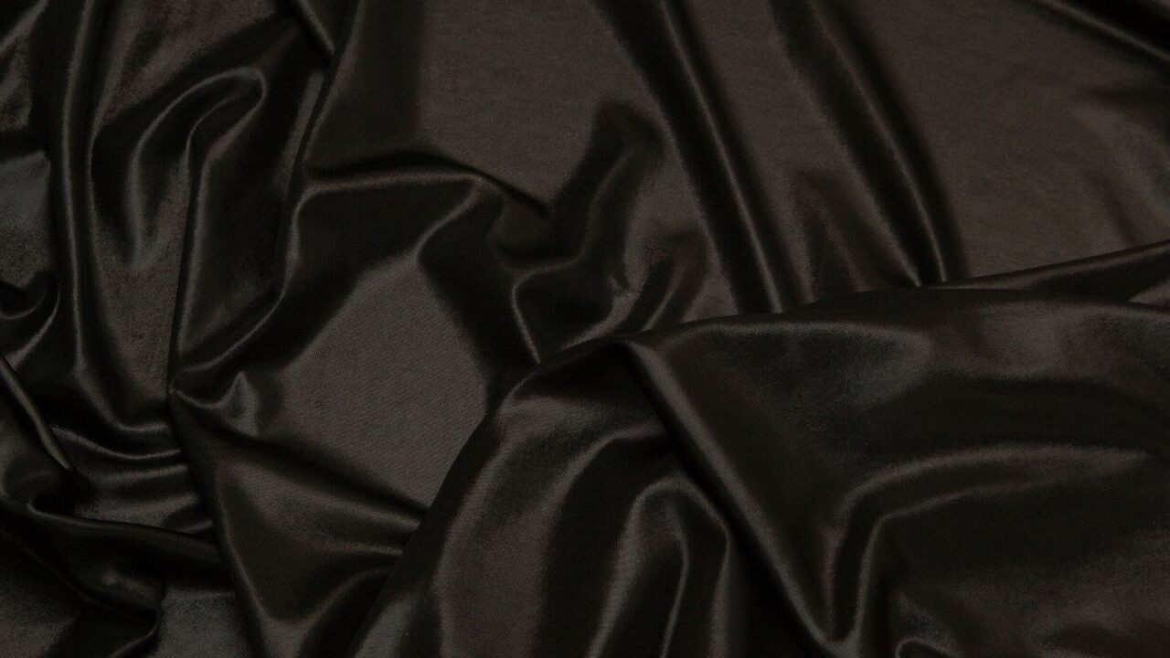 A black satin bedsheet.