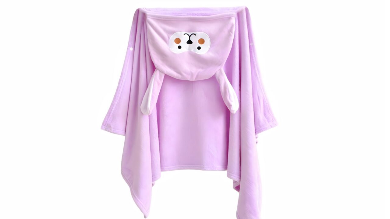 A purple hooded blanket with animal design.