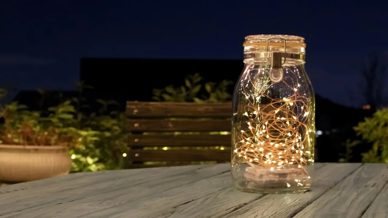 a mason jar fairy lights in a fancy restaurant in