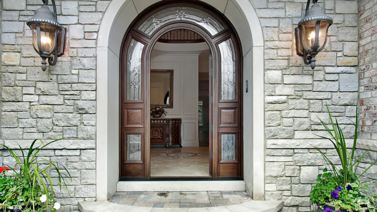 arched stone entry to luxury home