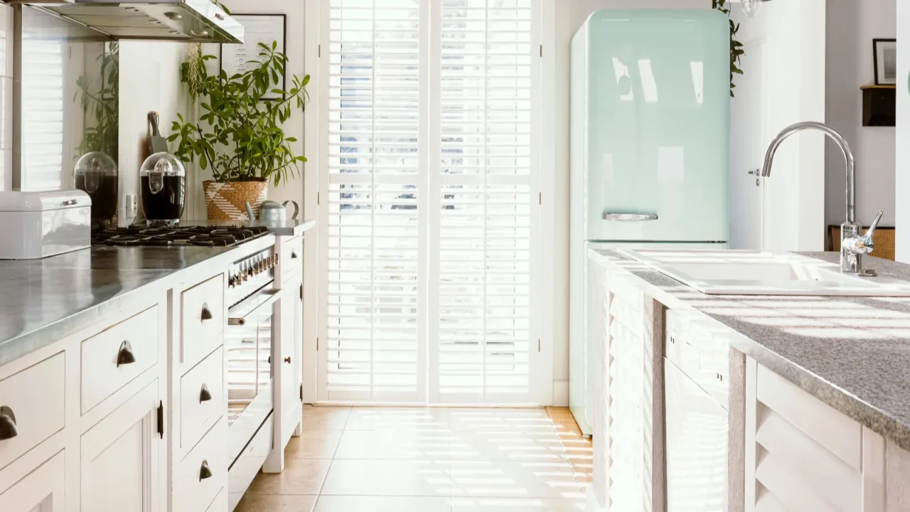 bright kitchen interior with modern white furniture pastel mint fridge