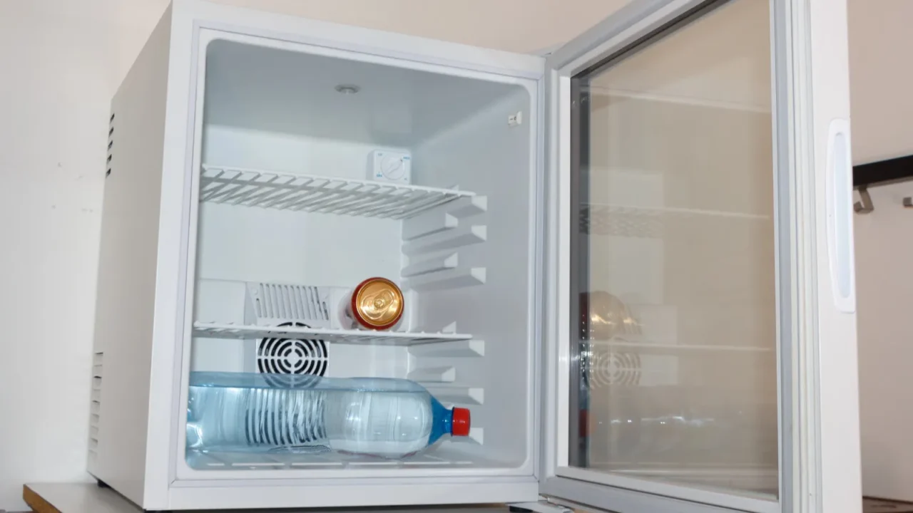 can and water bottle in a minifridge