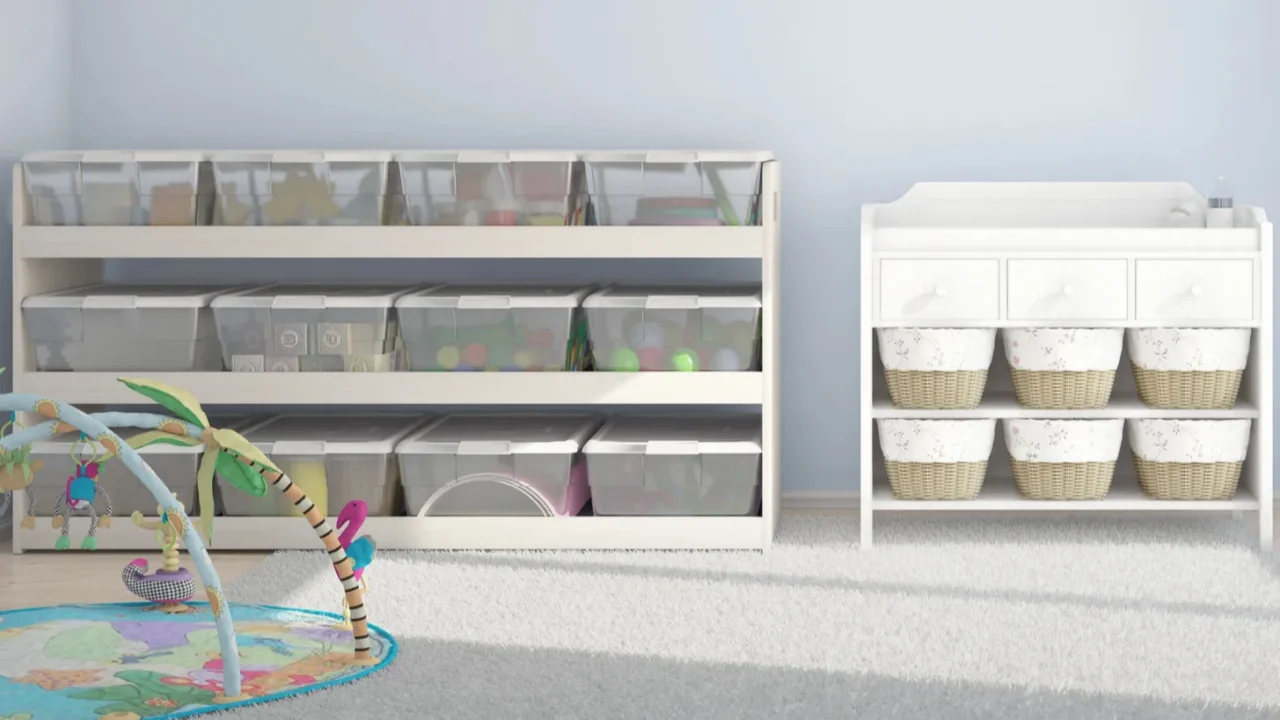 A shelf in children's playroom with clear storage bins with white lids.