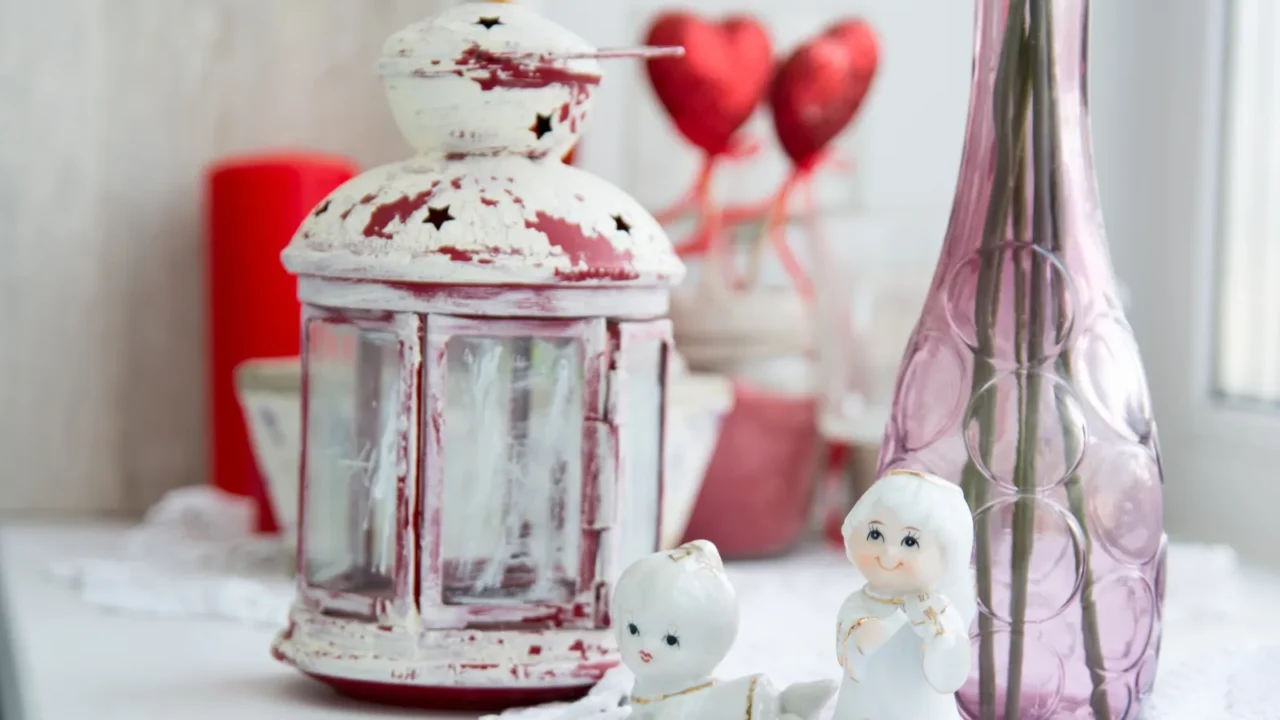 closeup of porcelain figurines with flowers on the windowsill a