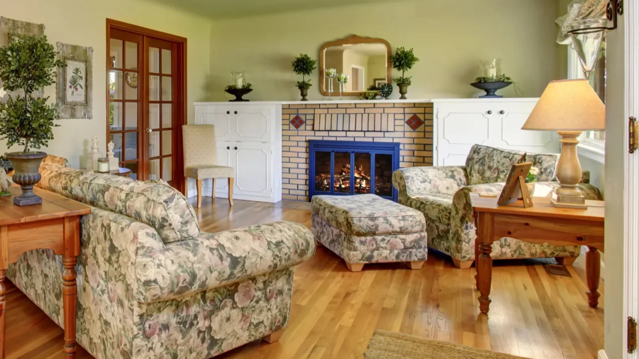 darling living room with green walls and floral sofas