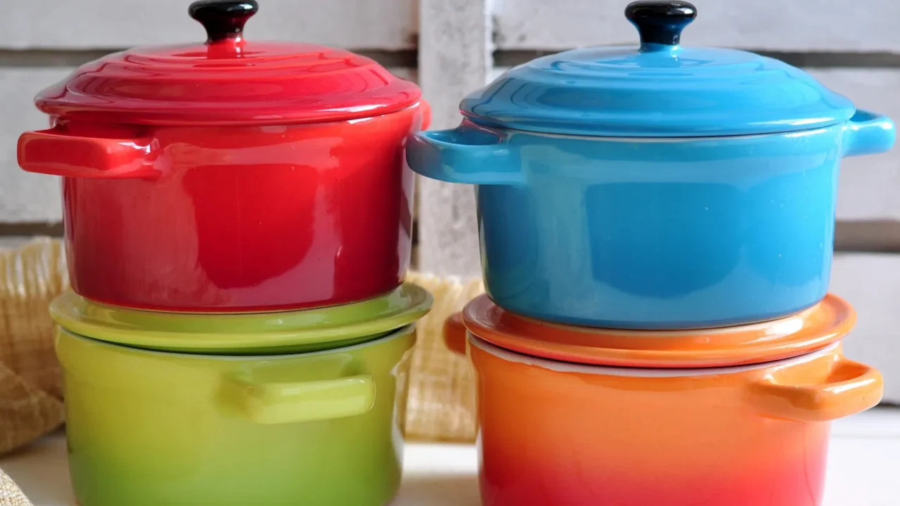 four little colorful cooking pots