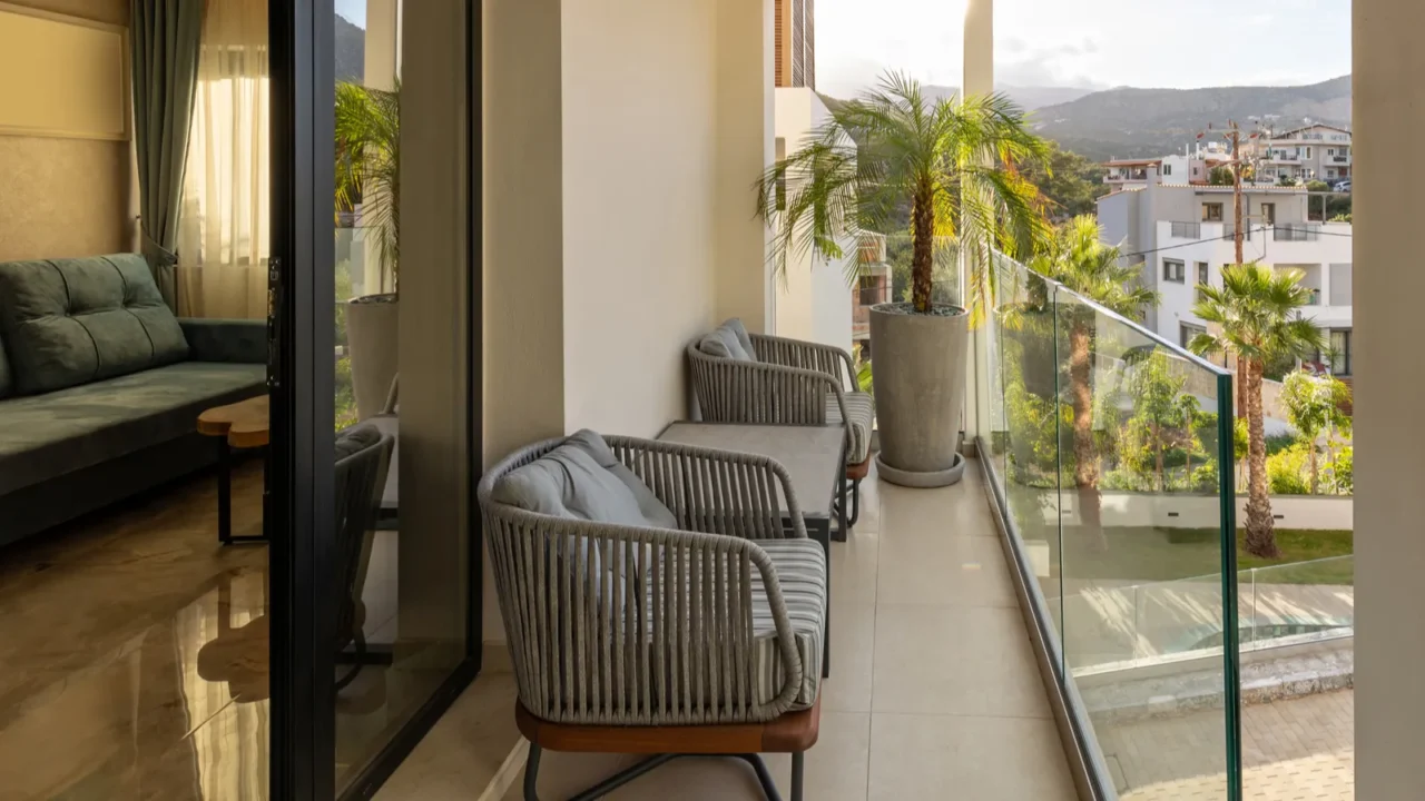 hotel terrace with plants and glass fence