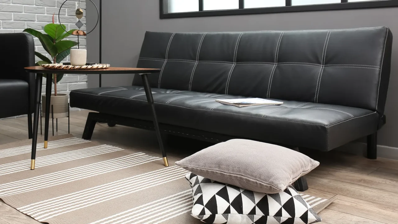 interior of living room with modern furniture near grey brick