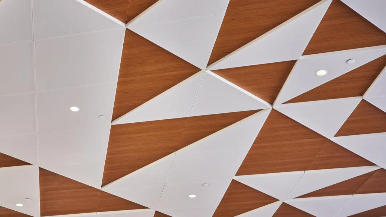 intricate geometric ceiling in minneapolis airport blending white and wood