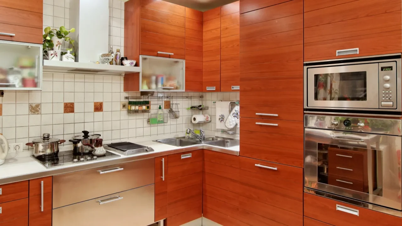 kitchen interior with wooden furniture and build in utensils