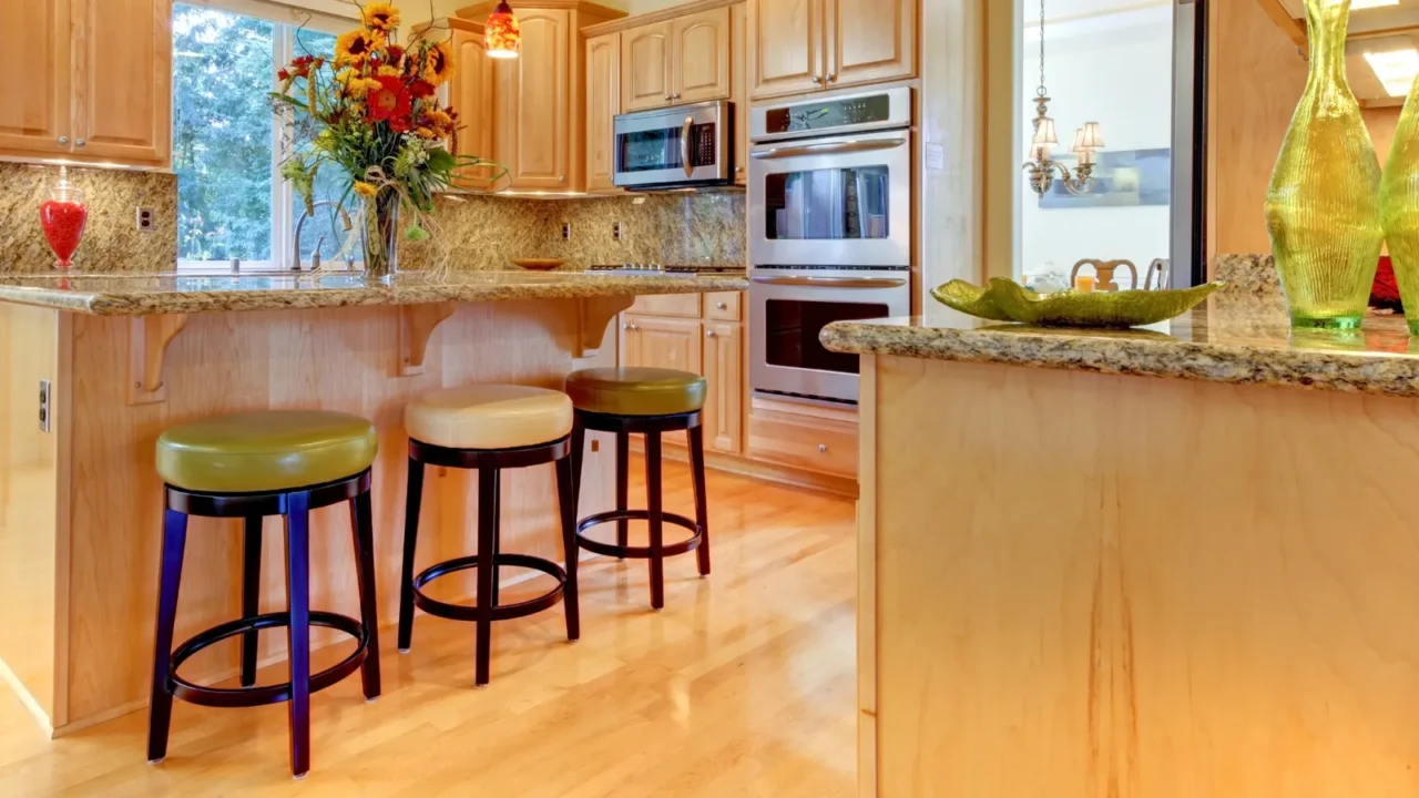 large luxury maple wood kitchen with island and stools