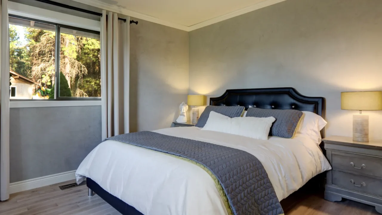 luxury cozy and elegant guest bedroom with black leather bed