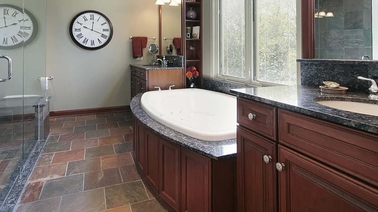 master bath with multicolored flooring