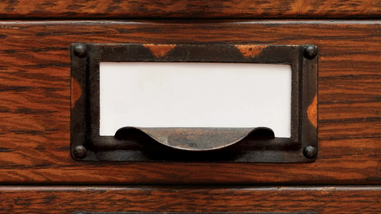 old file drawers with blank labels