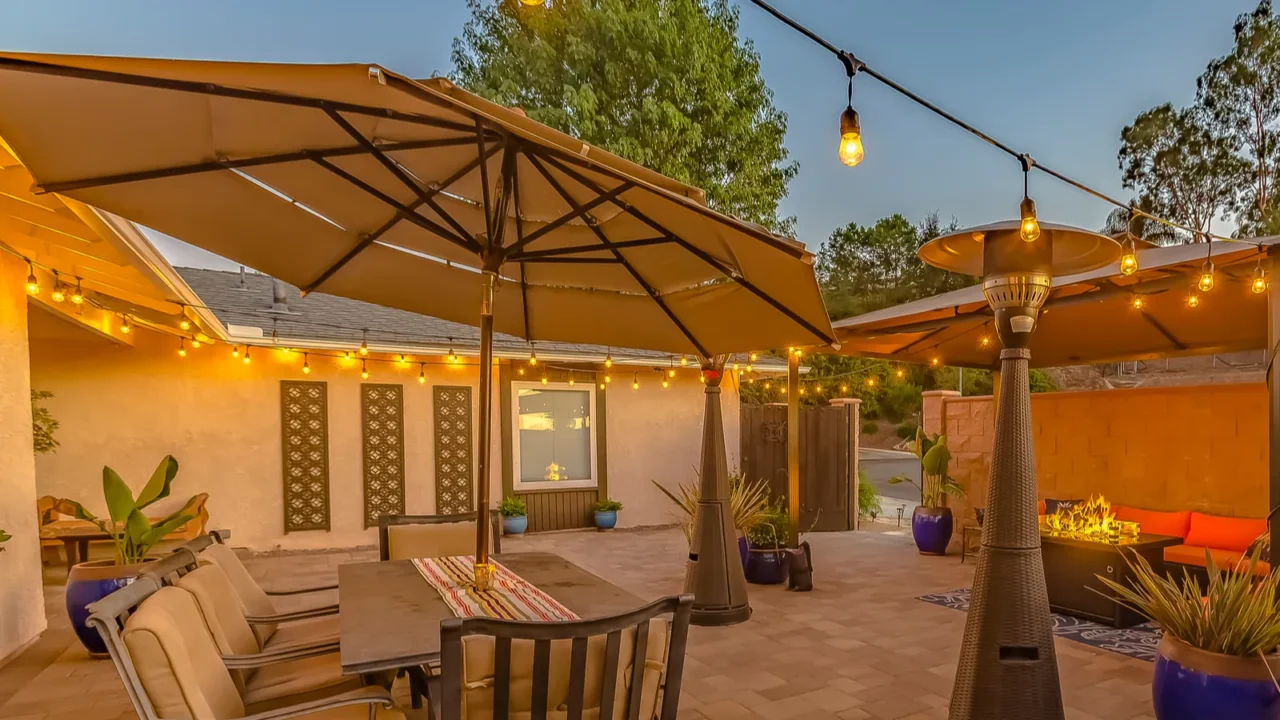 outdoor dining and seating area on the cozy stone patio