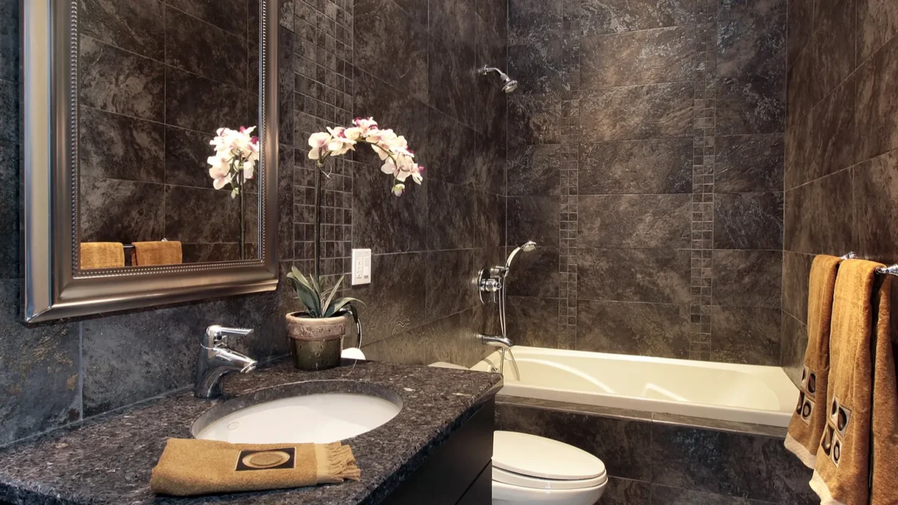 powder room with black granite walls