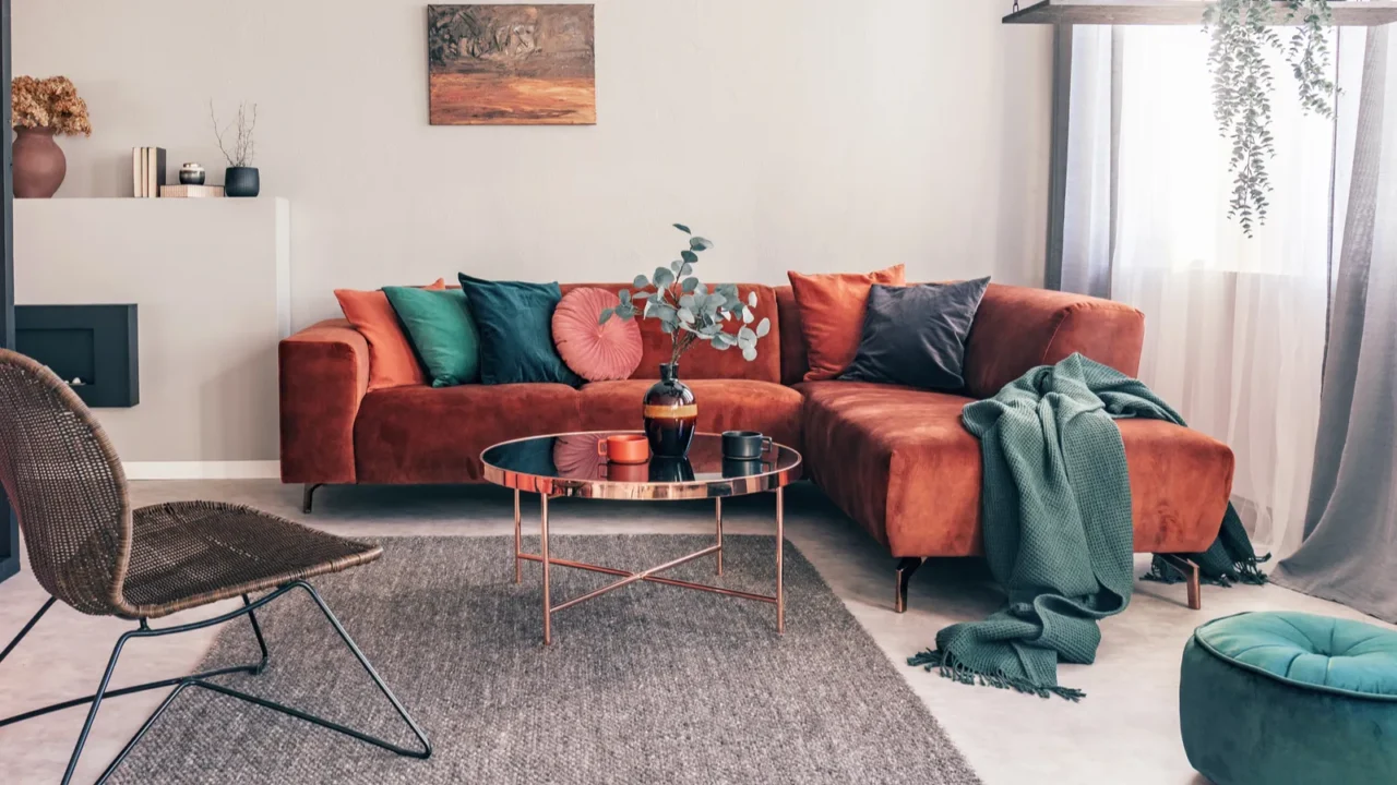 real photo of a wicker chair gray rug and red