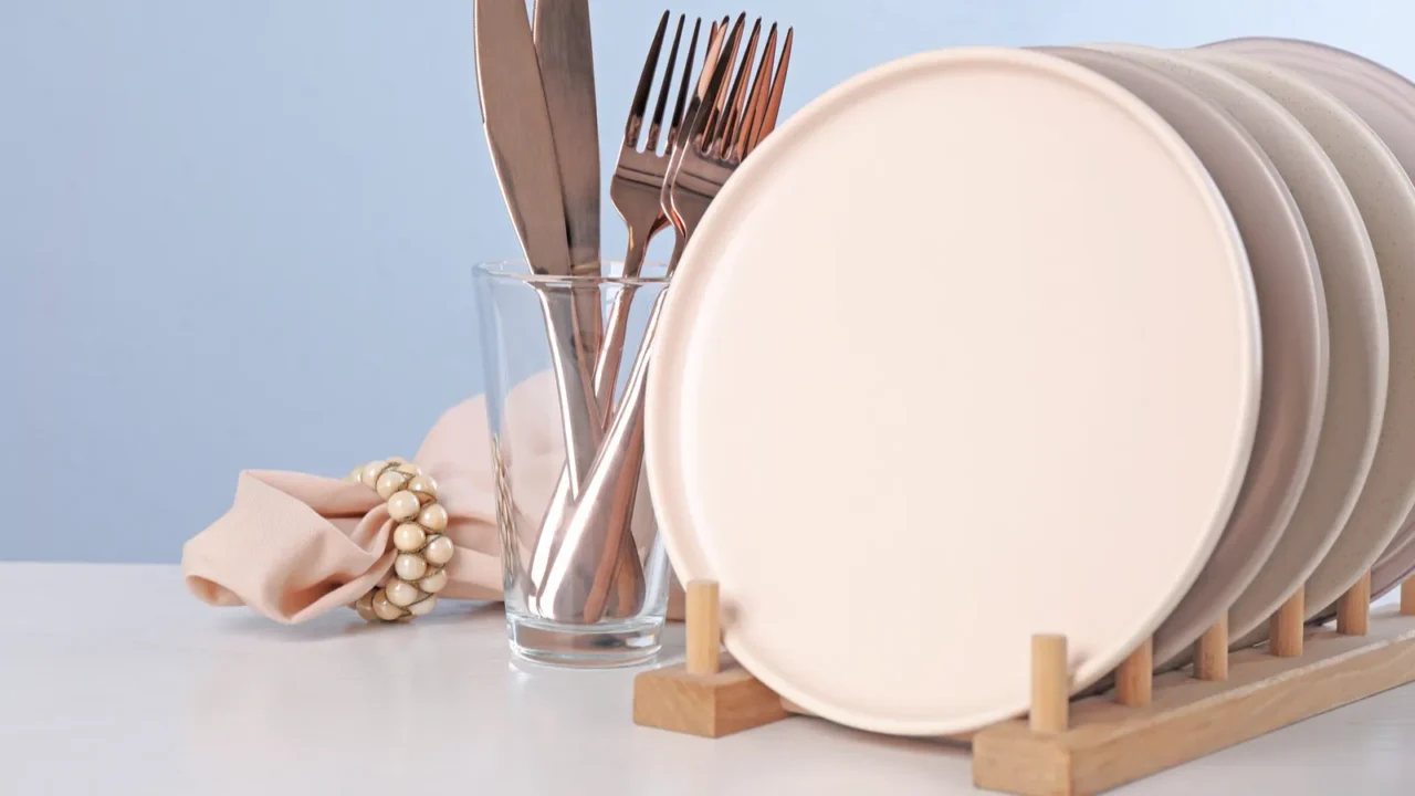 set of clean tableware on light table space for text