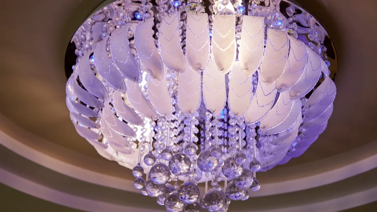 stylish designer chandelier on the ceiling in the hall