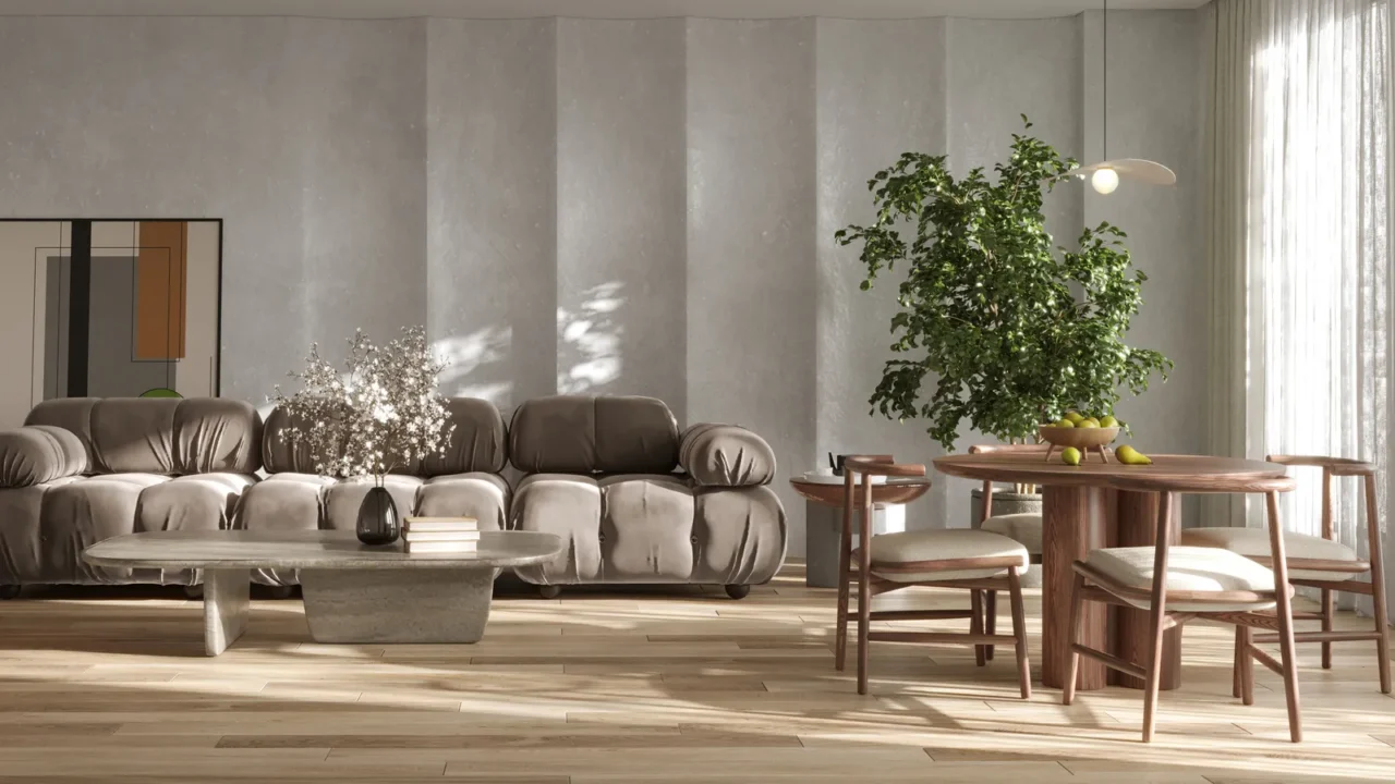 A cozy living and dining space with a brown sofa, wooden table, and vibrant greenery.