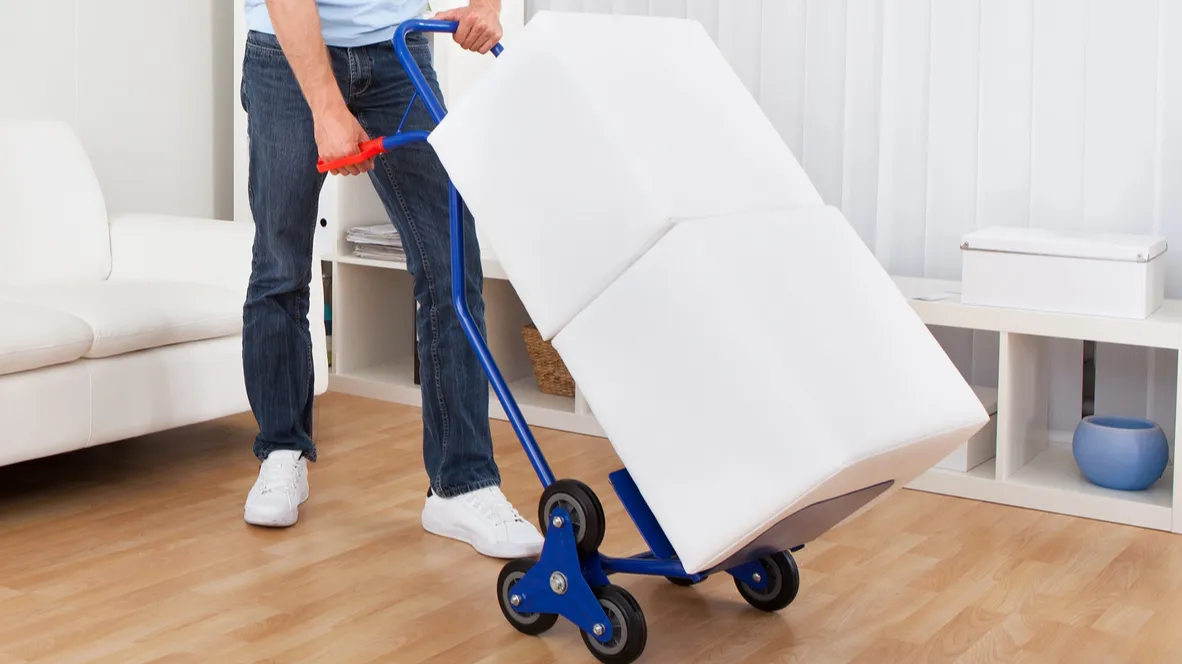 young man with box on trolley