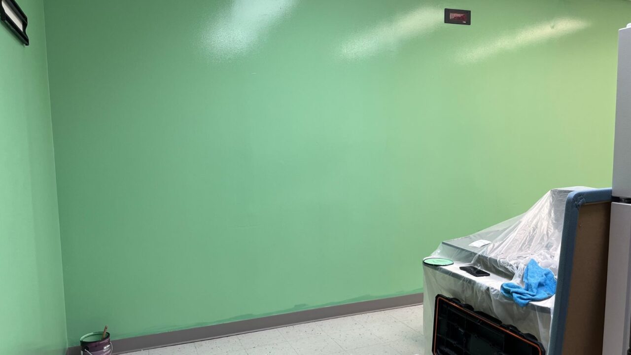 Green semi gloss paint on the walls.