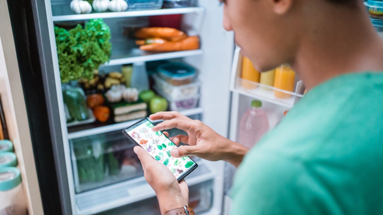 A person ordering grocery with mobile phone from an app.