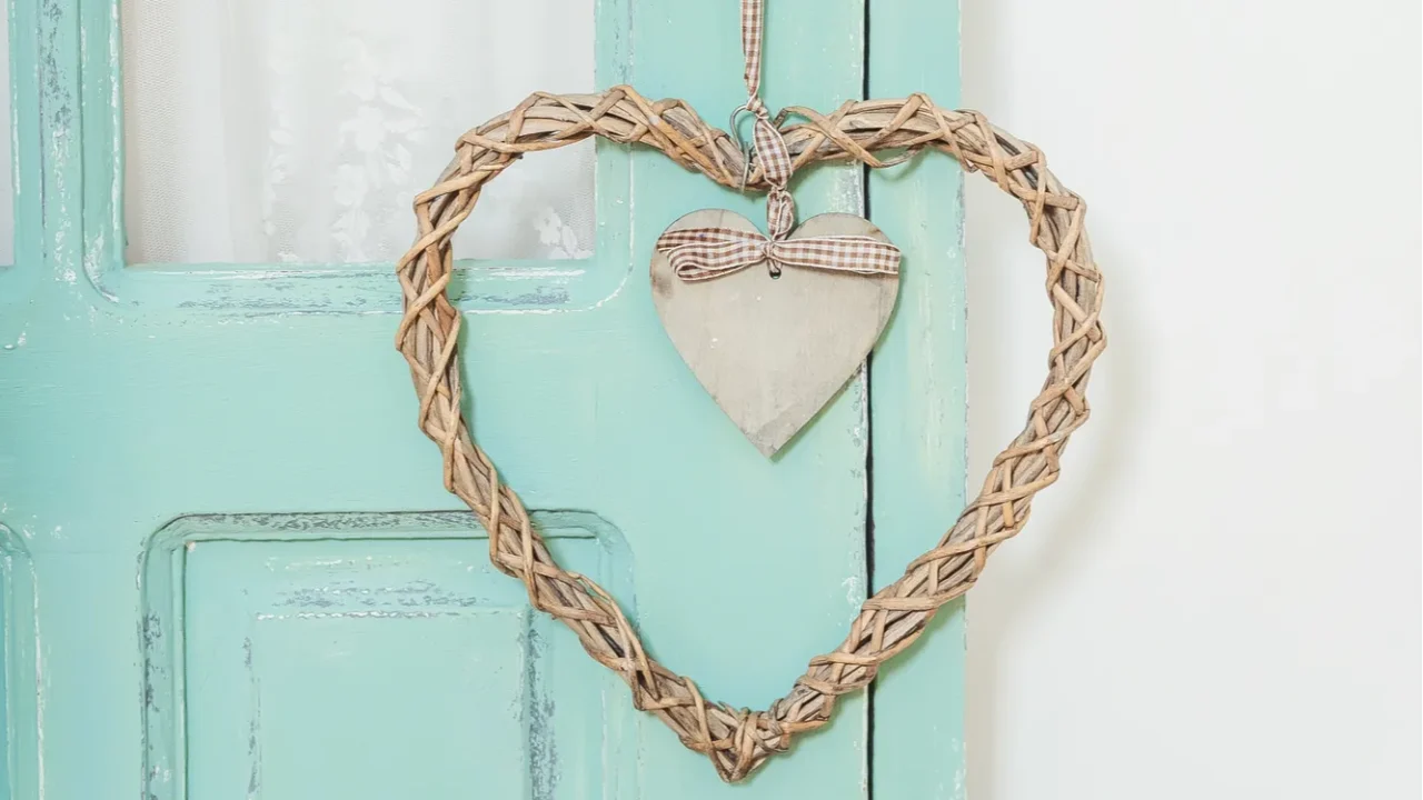 a wicker heartshaped wreath on the door a wreath of