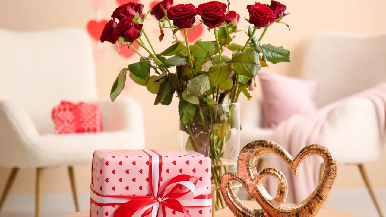 coffee table with bouquet of roses gift box and hearts