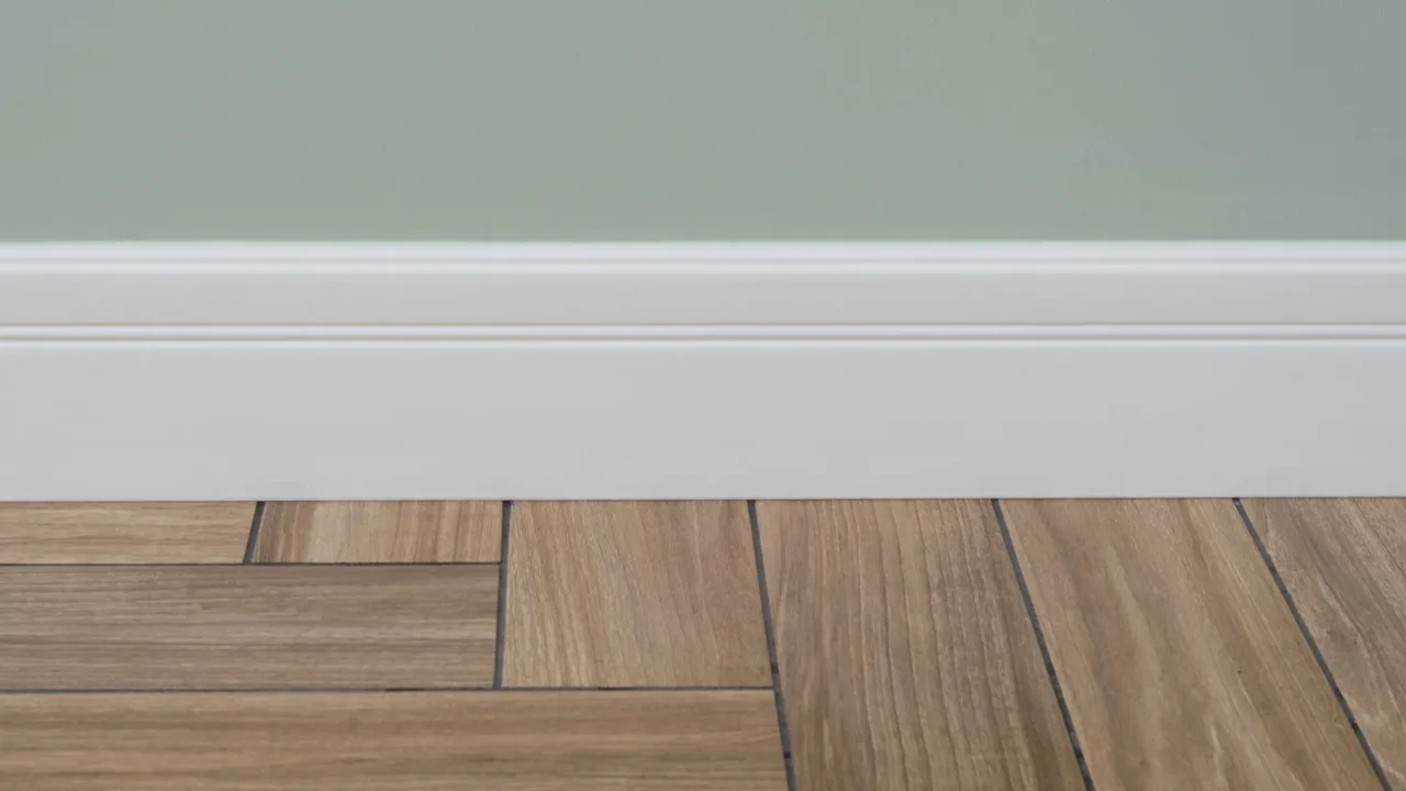 interior concept light matte wall white baseboard and tiles immitating