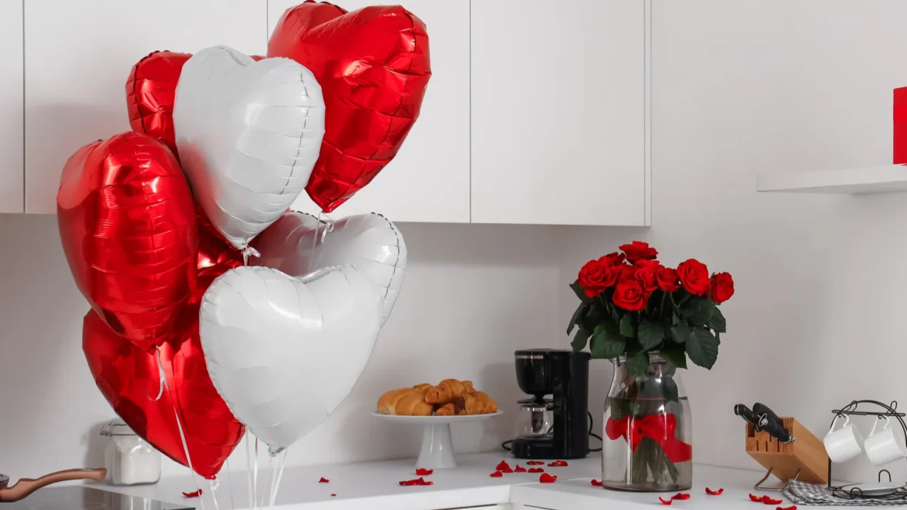 interior of festive kitchen with bouquet of roses and heartshaped