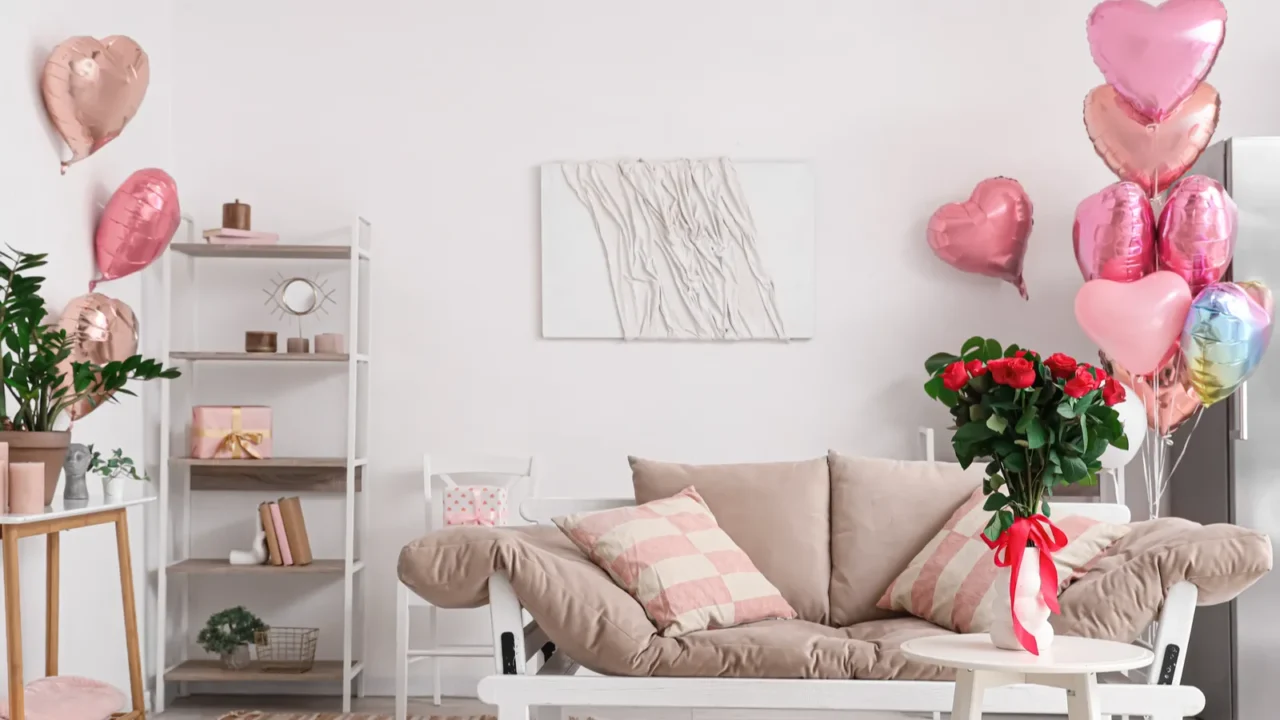 interior of festive living room decorated with heartshaped balloons for